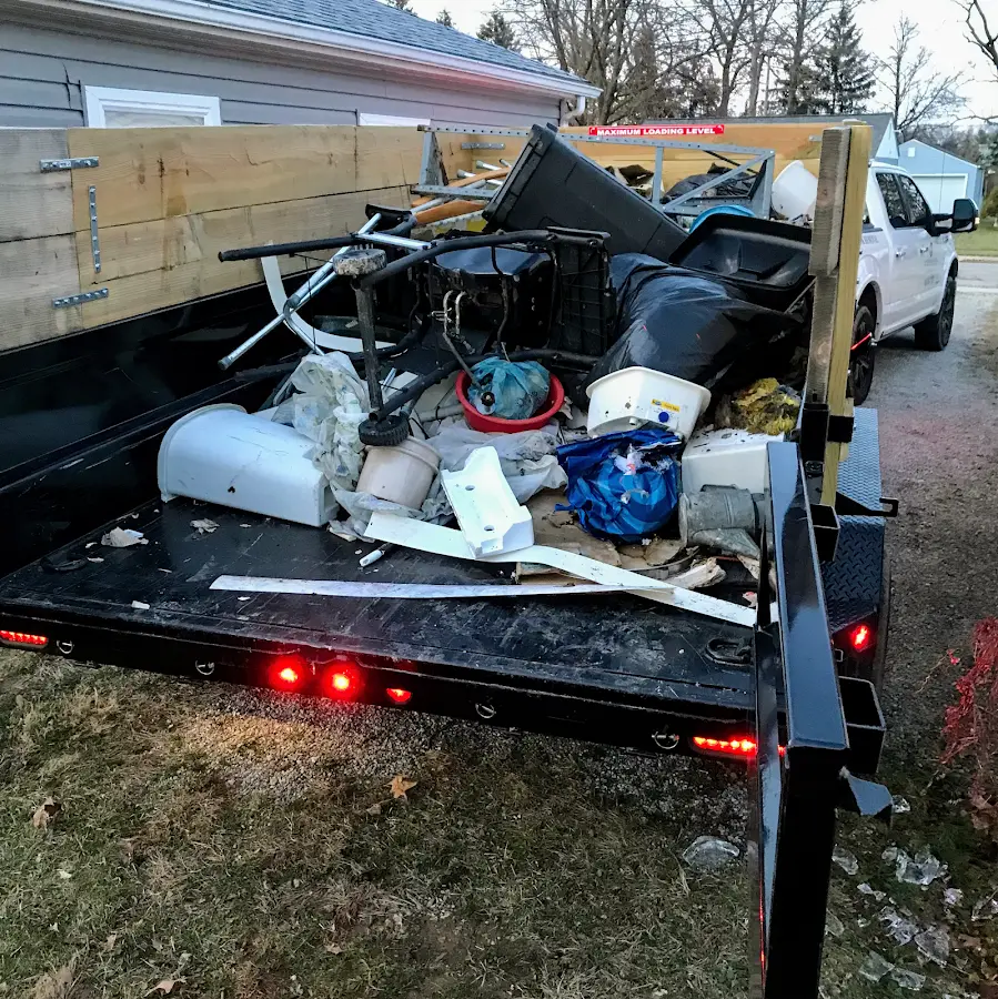 Roll-off dumpster delivered to a residential driveway in Plainville