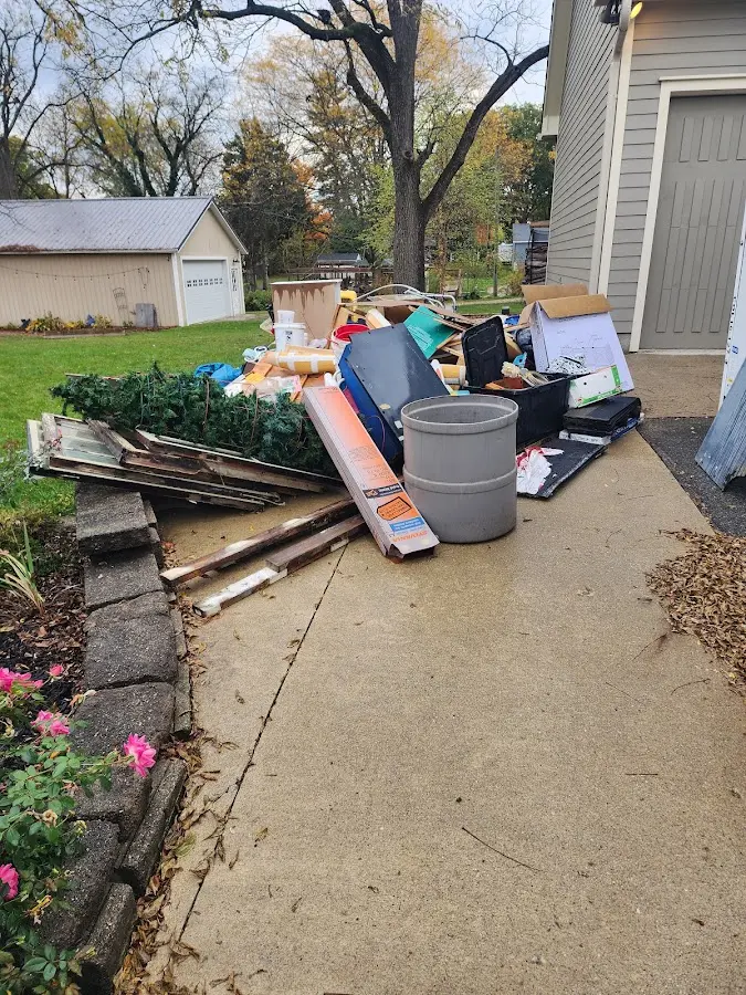Dumpster being loaded with debris for 3 Yard Dumpster Rental in Plainville